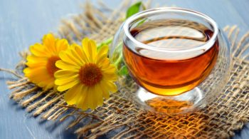 clear-glass-bowl-beside-yellow-flower-1638280-676x469